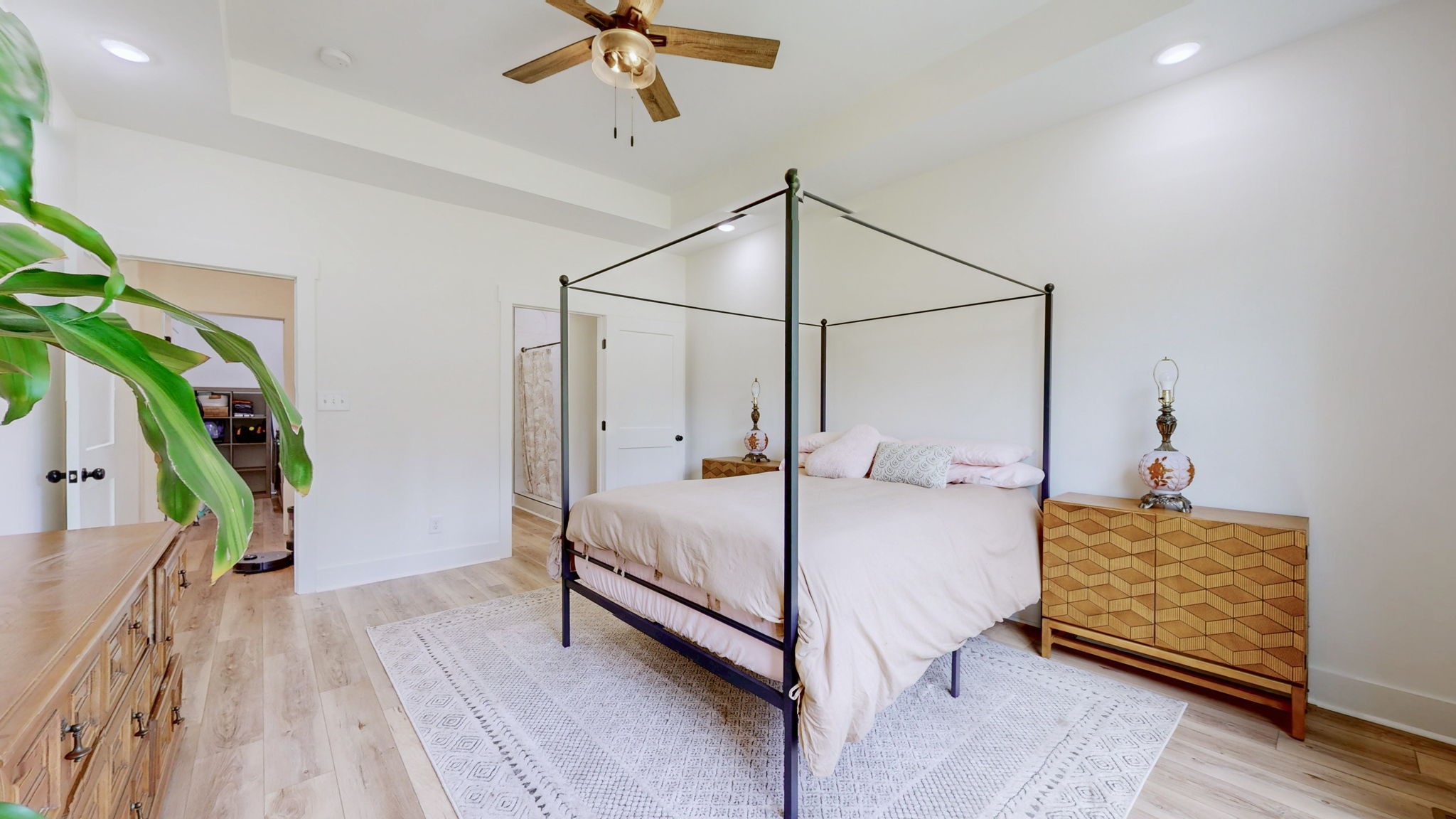 1663 Taylortown Road White Bluff, TN 37187 - Photo 21 of 38 a bedroom with a bed a rug and potted plant