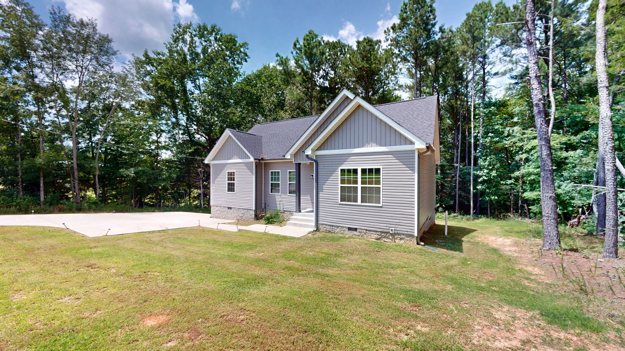 1663 Taylortown Road White Bluff, TN 37187 - Photo 26 of 38 a front view of a house with a yard and trees