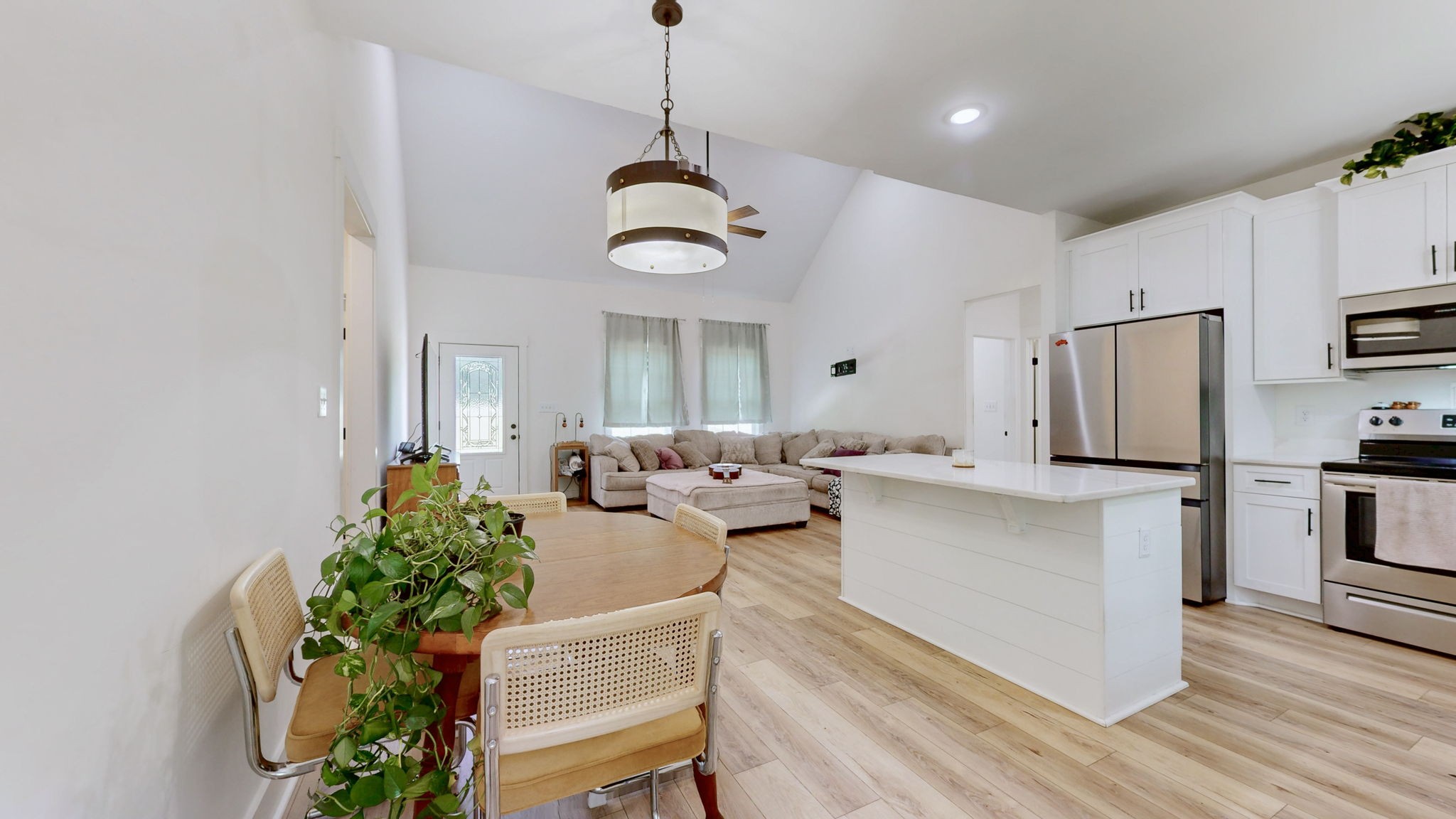 1663 Taylortown Road White Bluff, TN 37187 - Photo 7 of 38 a living room with kitchen island furniture and a chandelier