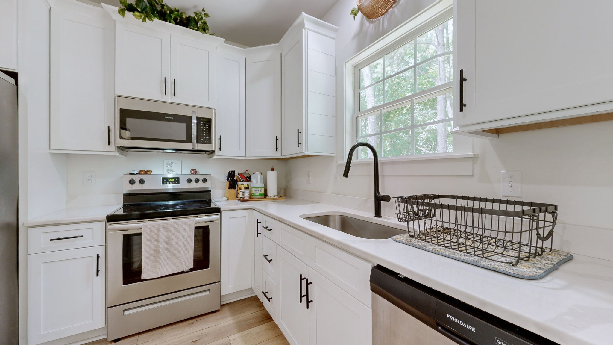 1663 Taylortown Road White Bluff, TN 37187 - Photo 10 of 38 a kitchen with stainless steel appliances granite countertop a stove and a sink
