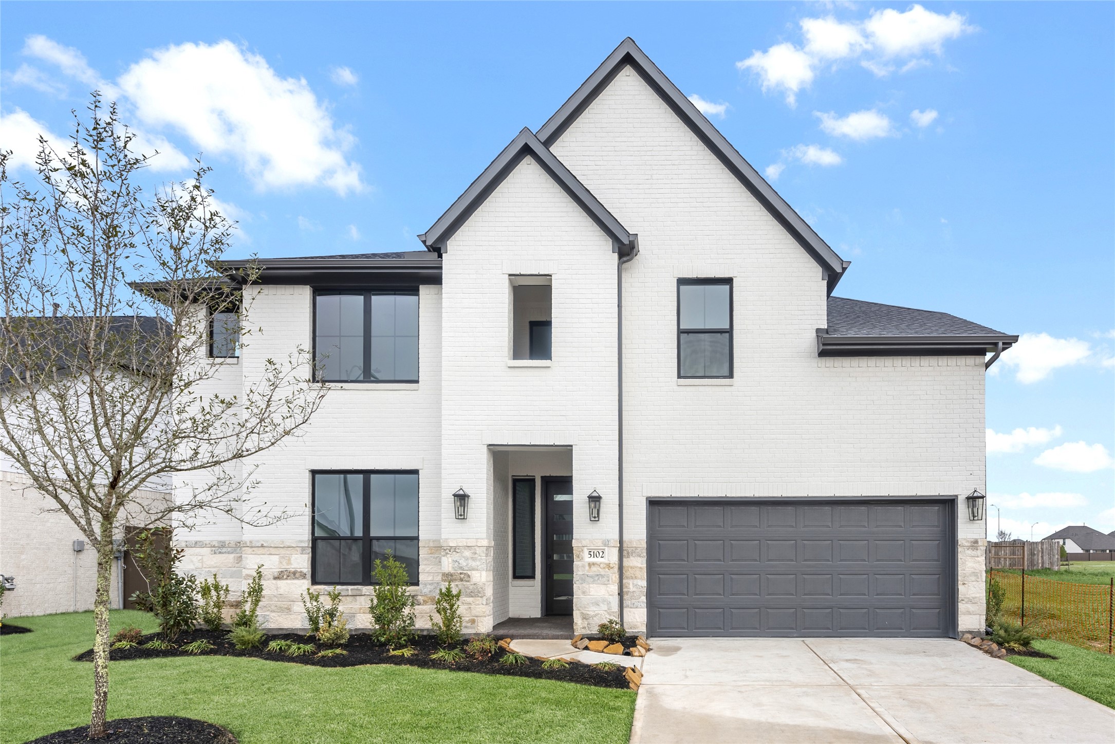 Move in ready. Westin Homes *New Construction* Lexington IX B plan. Grass is digitally enhanced.