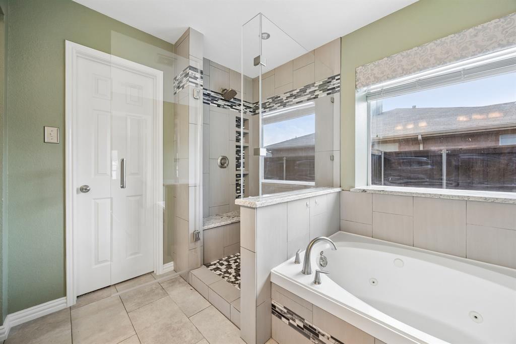 545 Rothschild Lane Murphy, TX 75094 - Photo 17 of 27 Large shower with glass-enclosed shower and bench and jetted garden tub.
