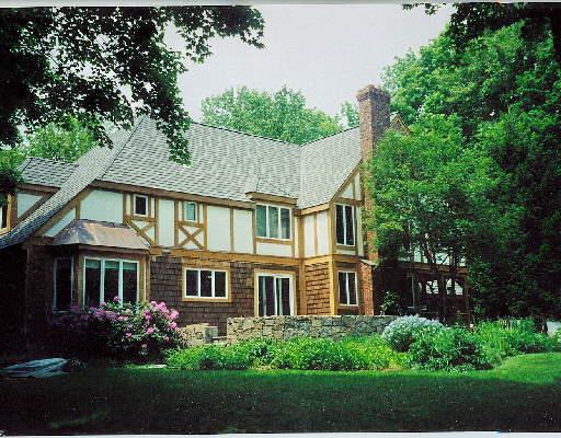 166 Tackora Trail Ridgefield, CT 06877 - Photo 1 of 1 a view of a house with many windows and garden