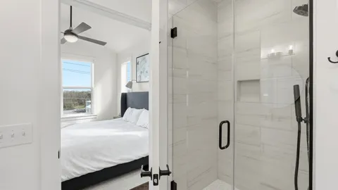 a bathroom with a bathtub and a shower