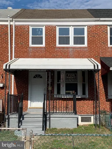 a front view of a house with a porch