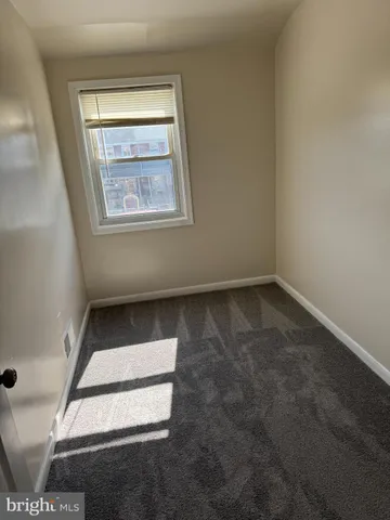 an empty room with wooden floor