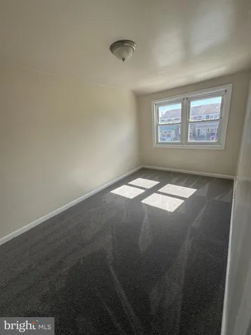 a view of a hallway with sliding door and stairs