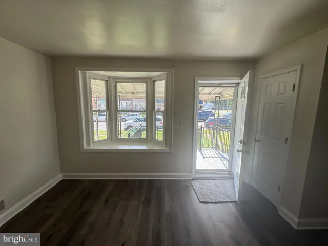 a view of entryway with wooden floor