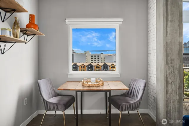 a view of a dining room with furniture and window
