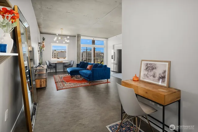 a living room with furniture and a large window