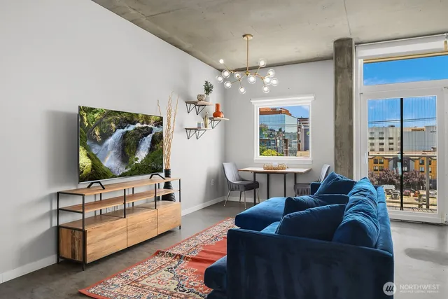 a living room with furniture and a flat screen tv