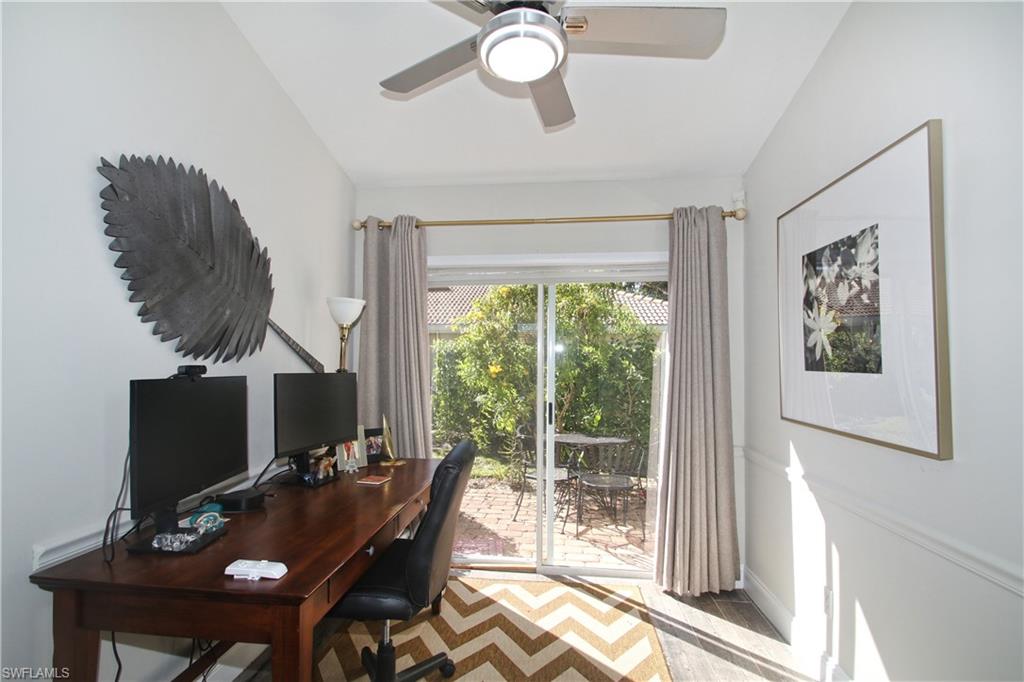 370 Emerald Bay Circle, Unit N8 Naples, FL 34110 - Photo 17 of 24 a view of a workspace with furniture and a window