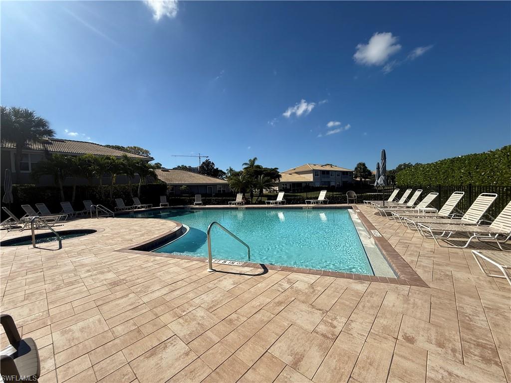 370 Emerald Bay Circle, Unit N8 Naples, FL 34110 - Photo 22 of 24 a view of outdoor space with swimming pool
