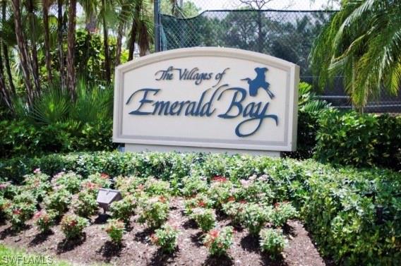 370 Emerald Bay Circle, Unit N8 Naples, FL 34110 - Photo 23 of 24 a sign that is sitting in front of flowers