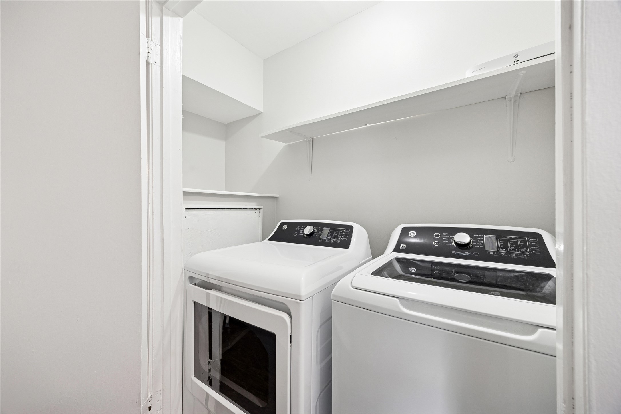2614 Cleburne Street Houston, TX 77004 - Photo 18 of 22 Everyday efficiency, hidden from view. A full-size washer and dryer closet optimized with clever storage solutions to keep daily tasks organized and completely out of sight.