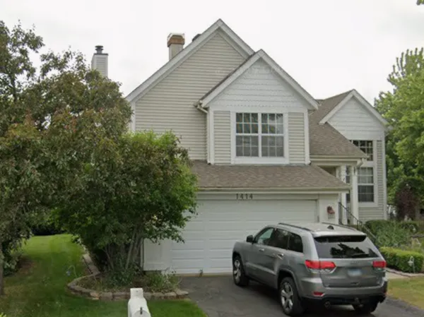 a car parked in front of a house