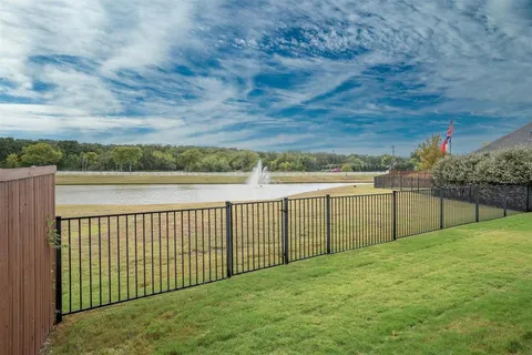 a view of a golf course with a lake view