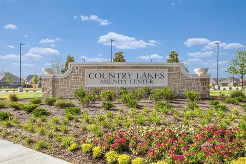 a view of swimming pool with a dining table chair and fire pit
