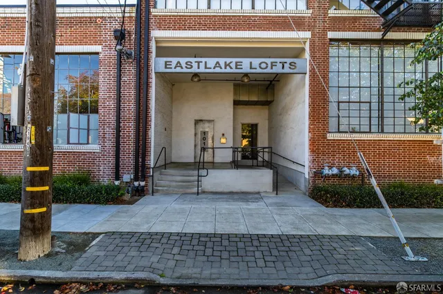 a view of a building with potted plants