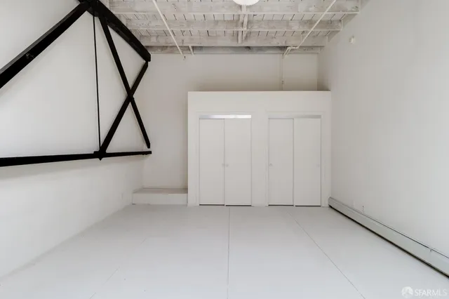 a view of an empty room with stairs