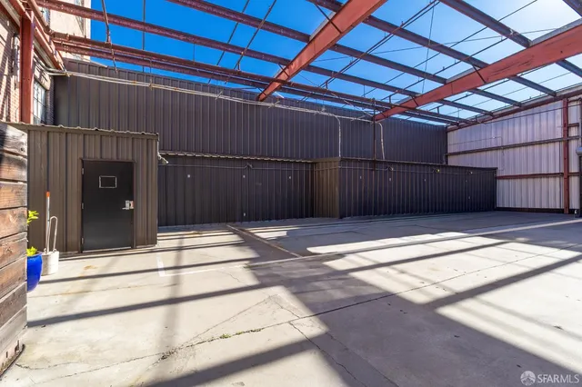 a view of a hallway with seating area
