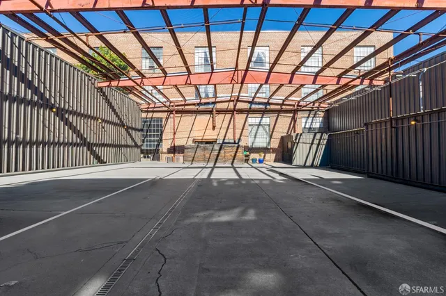 a view of a large building with a street