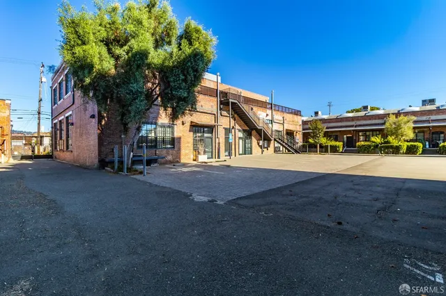 a view of a street with cars