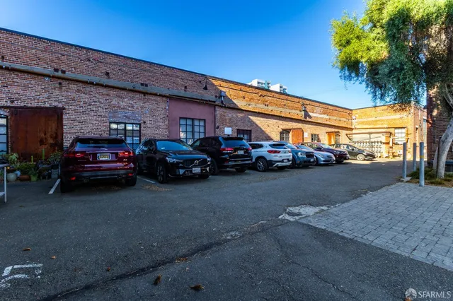 a view of a patio with table and chairs and potted plants