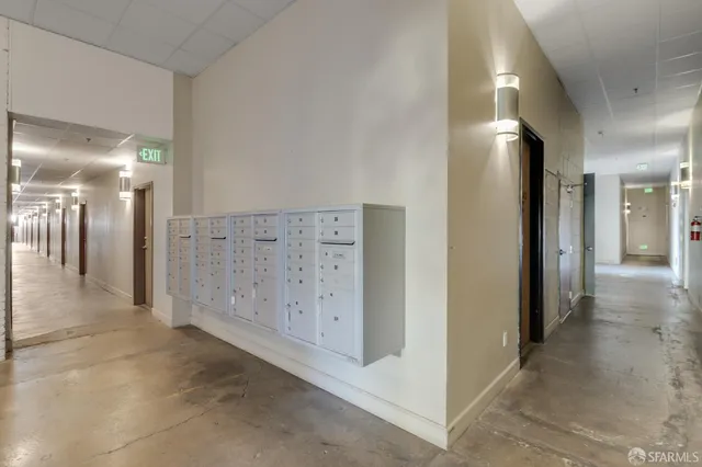 a view of a hallway with wooden shelves