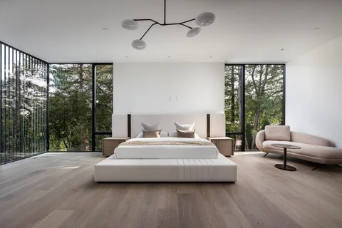 a large spacious bathroom with a large tub and large window