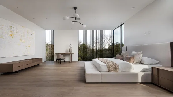 a bedroom with furniture and a window