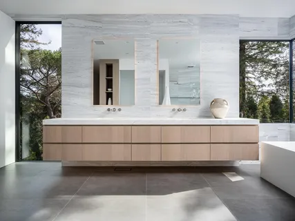 a bedroom with a bed and a chair