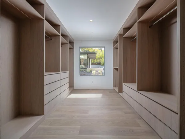a bathroom with a bathtub sink and mirror