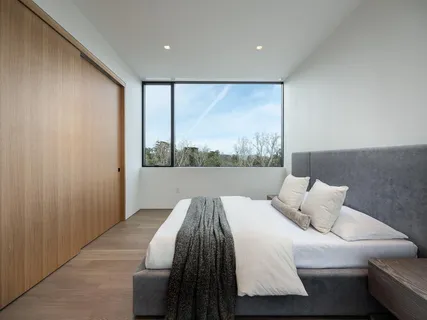 a bathroom with a bathtub sink and mirror