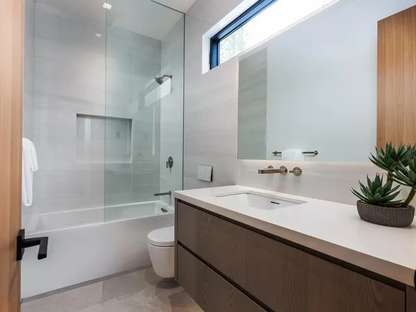 a spacious bathroom with a bathtub and sink
