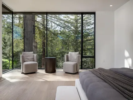 a view of a house with backyard porch and sitting area