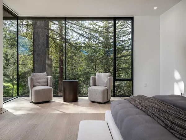 a view of a house with backyard porch and sitting area