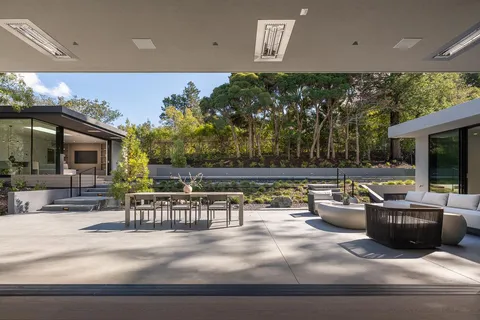 a view of a swimming pool with an outdoor seating