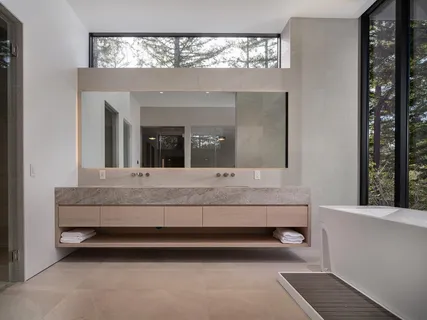 a kitchen with a table and chairs in it