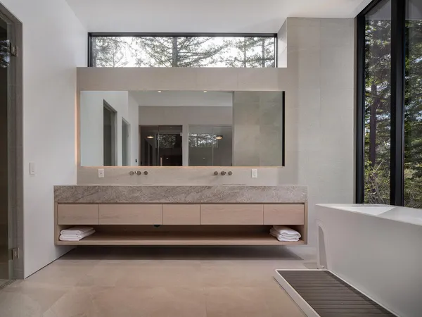 a kitchen with a table and chairs in it