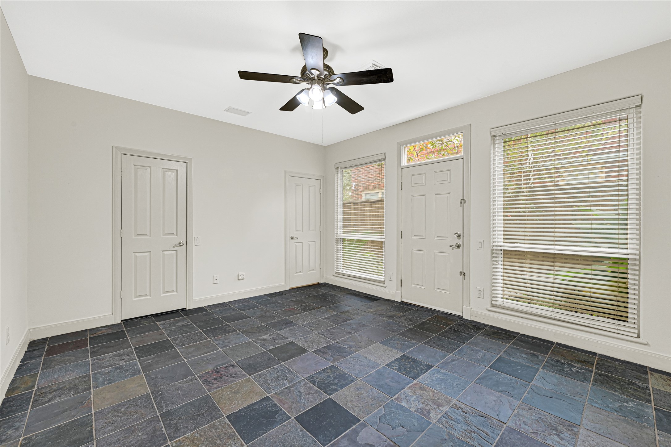 2414 Calumet Street, Unit B Houston, TX 77004 - Photo 5 of 27 a view of empty room with wooden floor and fan