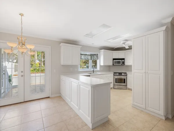 a kitchen with stainless steel appliances a sink stove and refrigerator