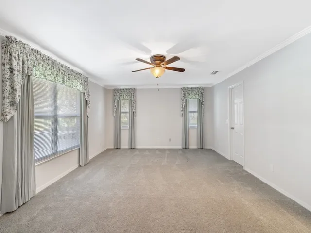 a kitchen with a sink cabinets and window