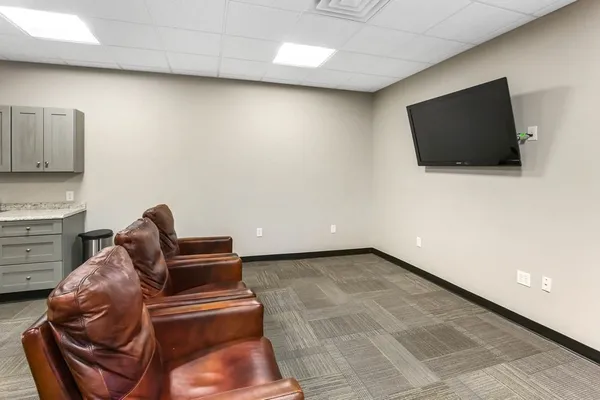 a picture of a bathroom with a shower