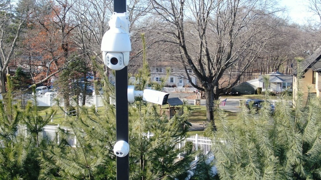 5 Harrington Street Mendon, MA 01756 - Photo 2 of 17 a backyard of a house with lots of green space and fountain