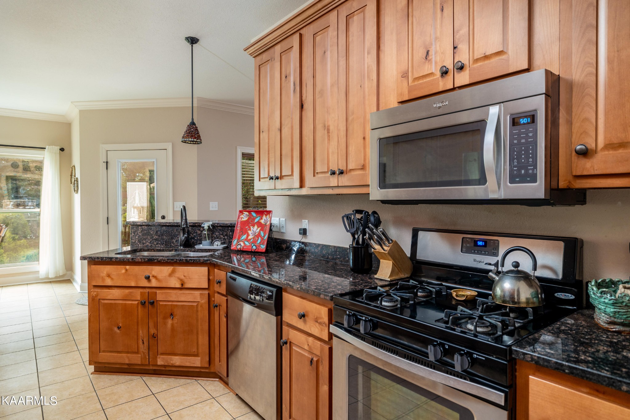 232 Riverview Road Townsend, TN 37882 - Photo 23 of 38 a kitchen with stainless steel appliances granite countertop a stove a sink and a microwave