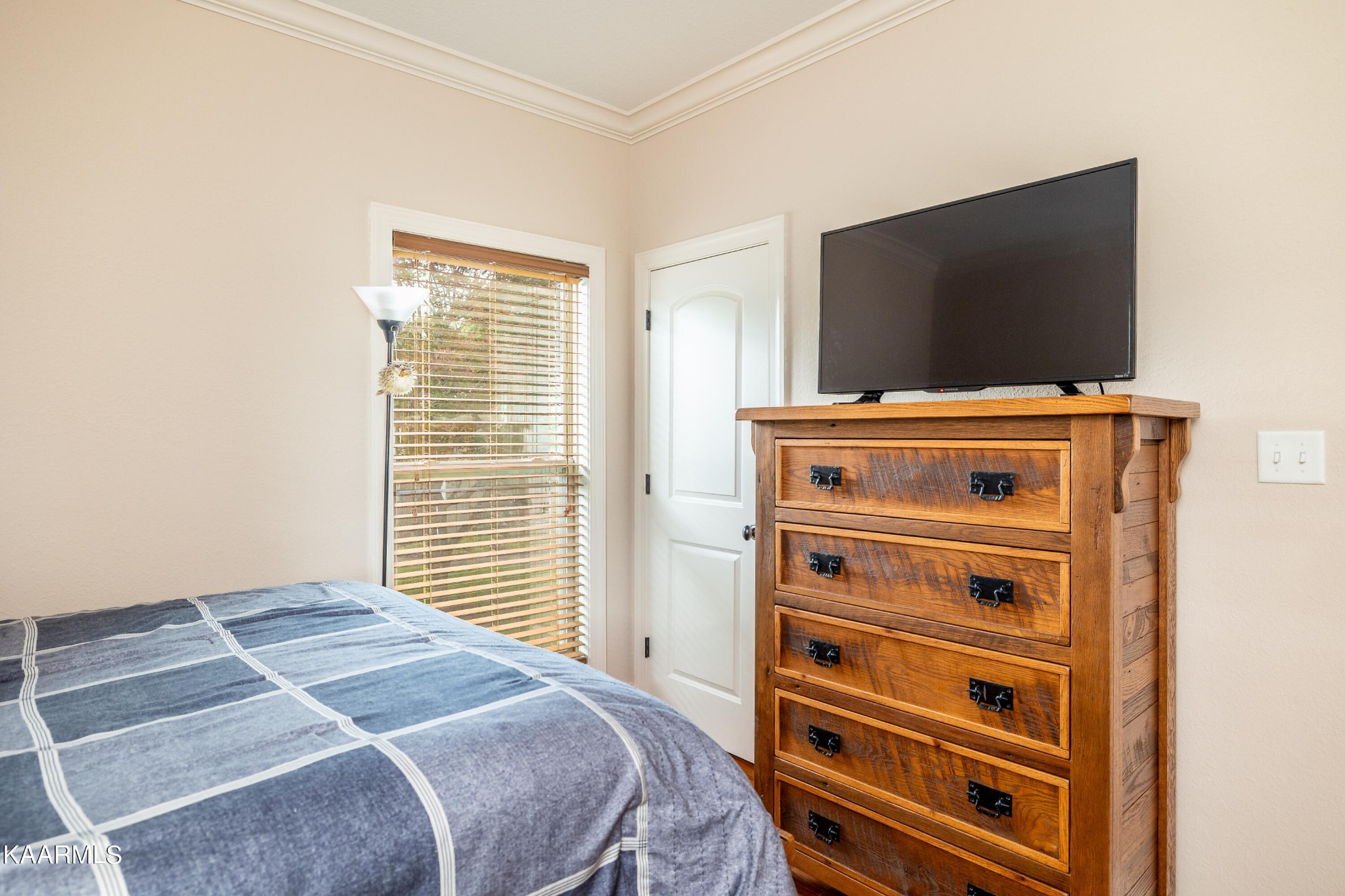 232 Riverview Road Townsend, TN 37882 - Photo 35 of 38 a bedroom with a bed and a flat screen tv