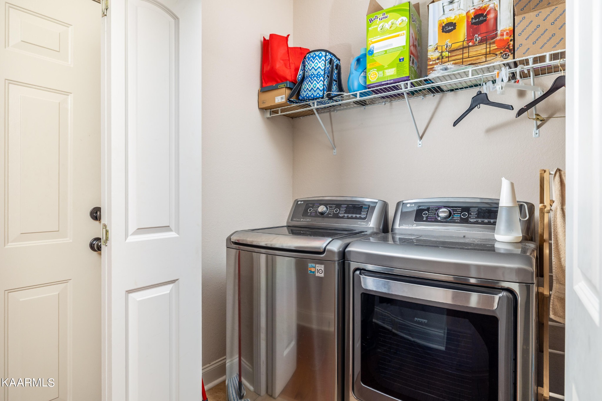 232 Riverview Road Townsend, TN 37882 - Photo 36 of 38 a utility room with dryer washer and empty racks