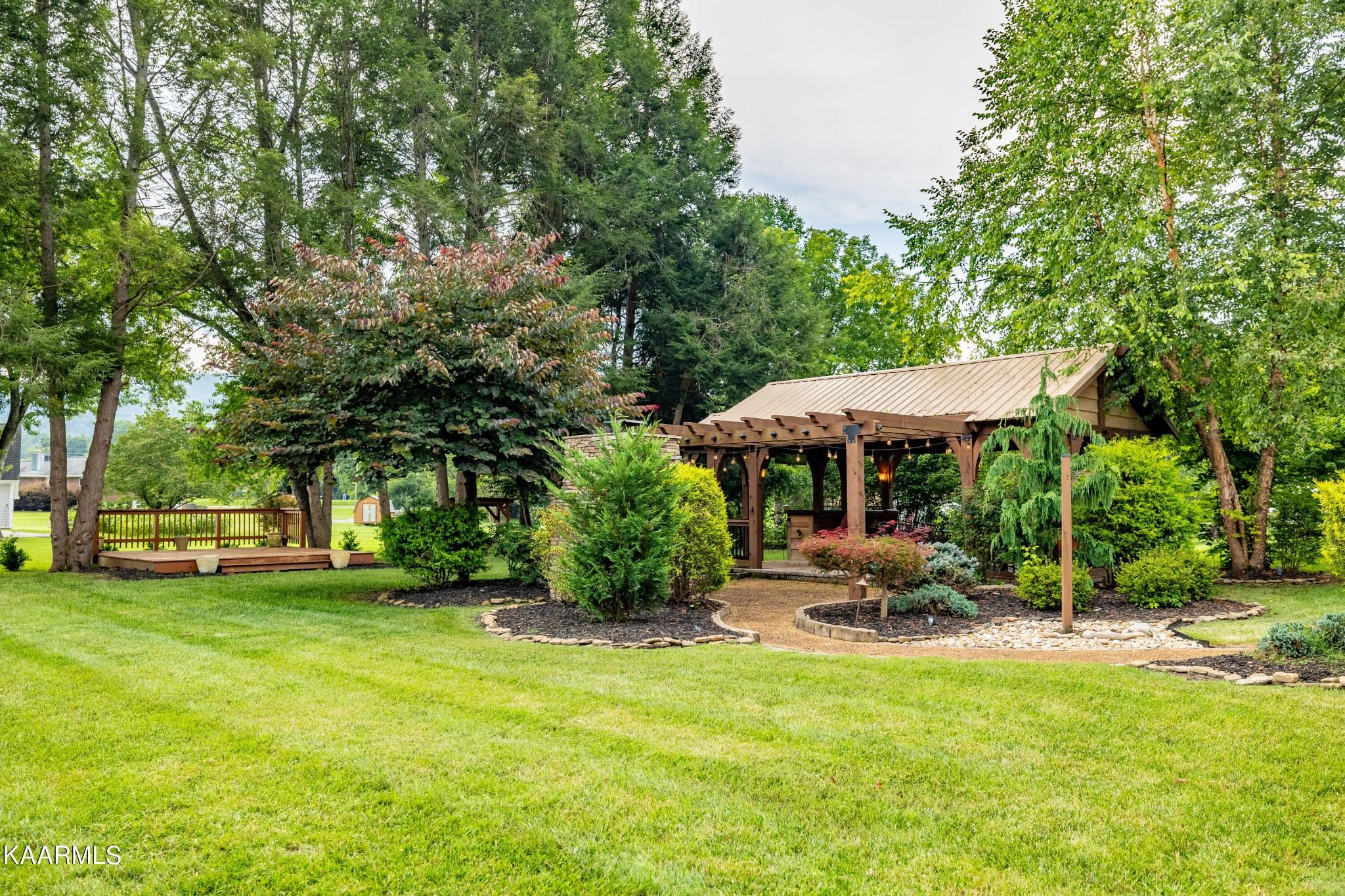 232 Riverview Road Townsend, TN 37882 - Photo 7 of 38 a backyard of a house with yard barbeque oven and outdoor seating