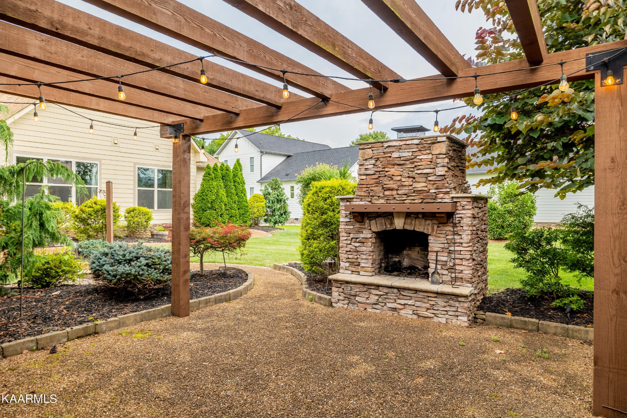 232 Riverview Road Townsend, TN 37882 - Photo 9 of 38 a view of a fireplace with porch and garden